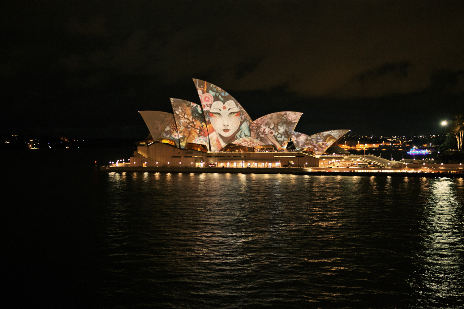 Celebrating with a view of Sydney Opera House by Mario Zmudzinski at Magnum Studio