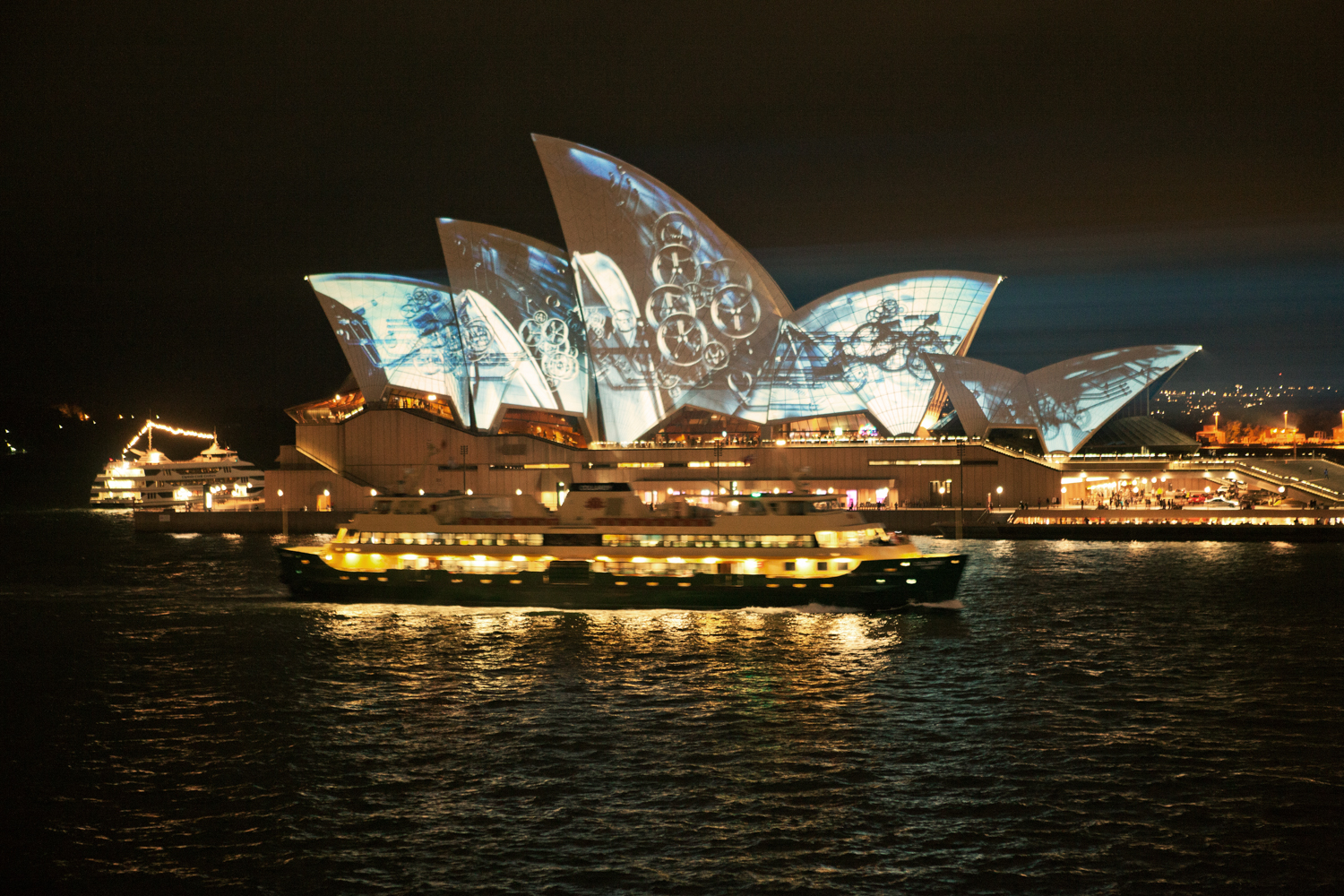 Aerial view of the Sydney Opera House and Harbour Bridge during sunset by Mario Zmudzinski at Magnum Studio