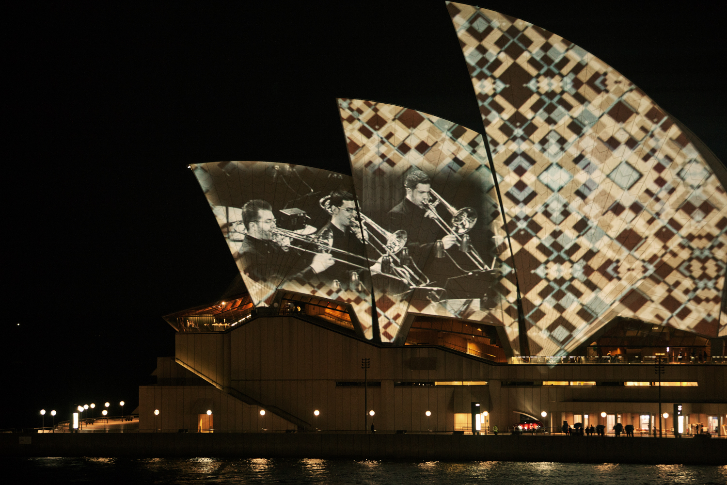 Night view of the illuminated Sydney Opera House by Mario Zmudzinski at Magnum Studio