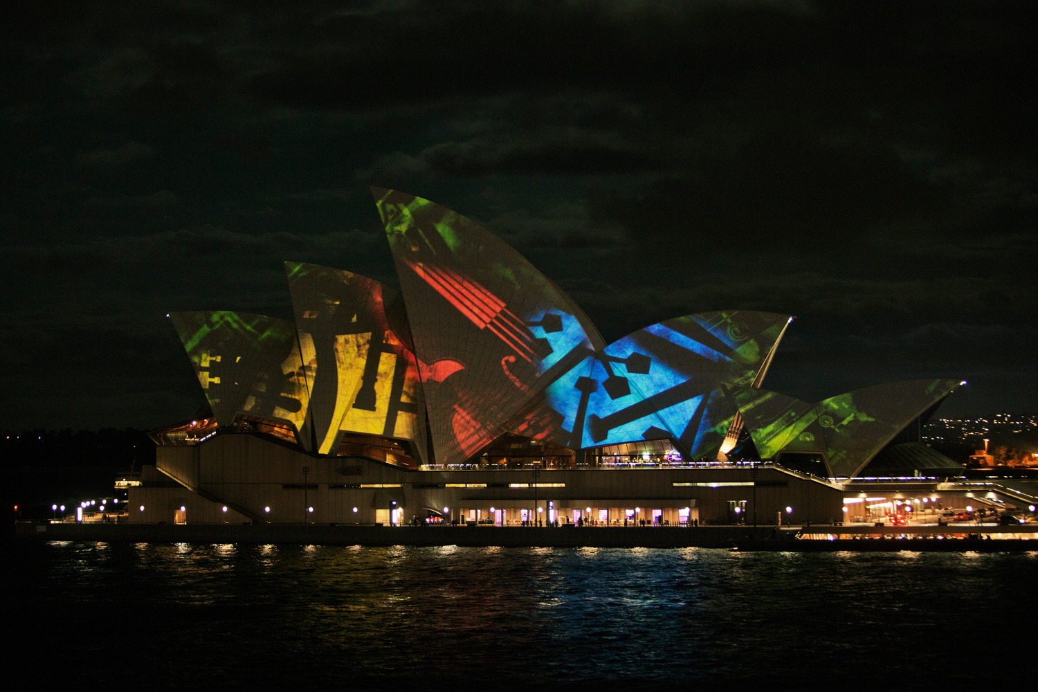 Night view of the illuminated Sydney Opera House by Mario Zmudzinski at Magnum Studio