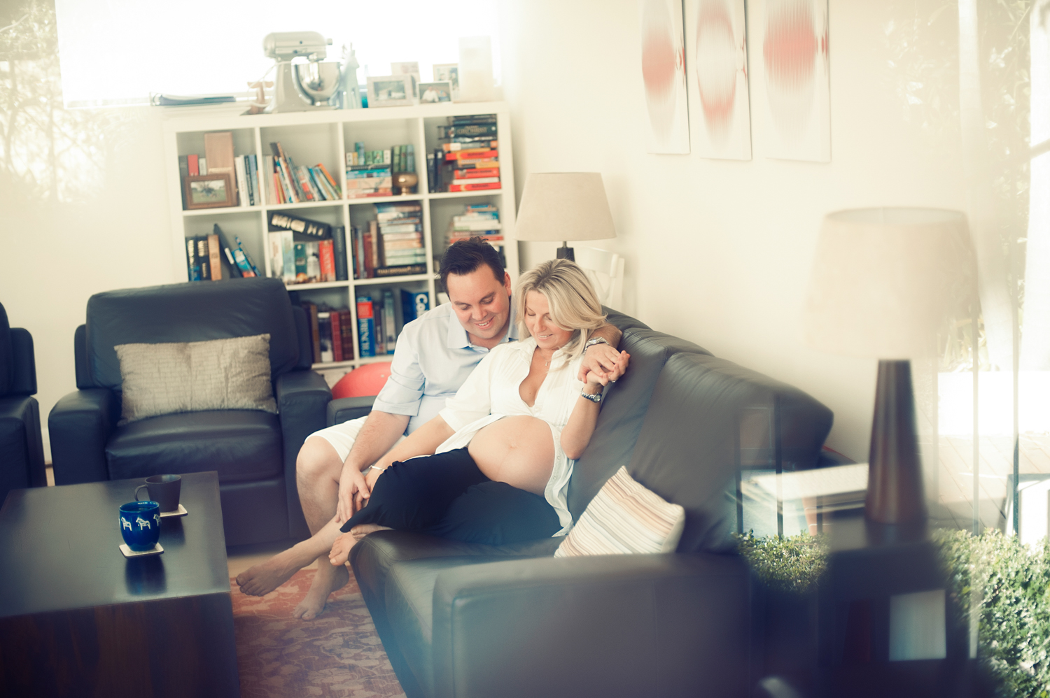 A moment of intimacy captured during pregnancy shoot at Magnum Studio by Mario Zmudzinski