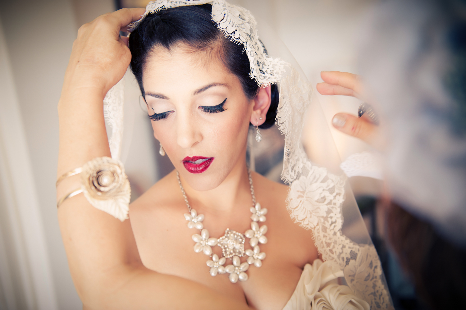 Bride getting ready with the help of her friends and family