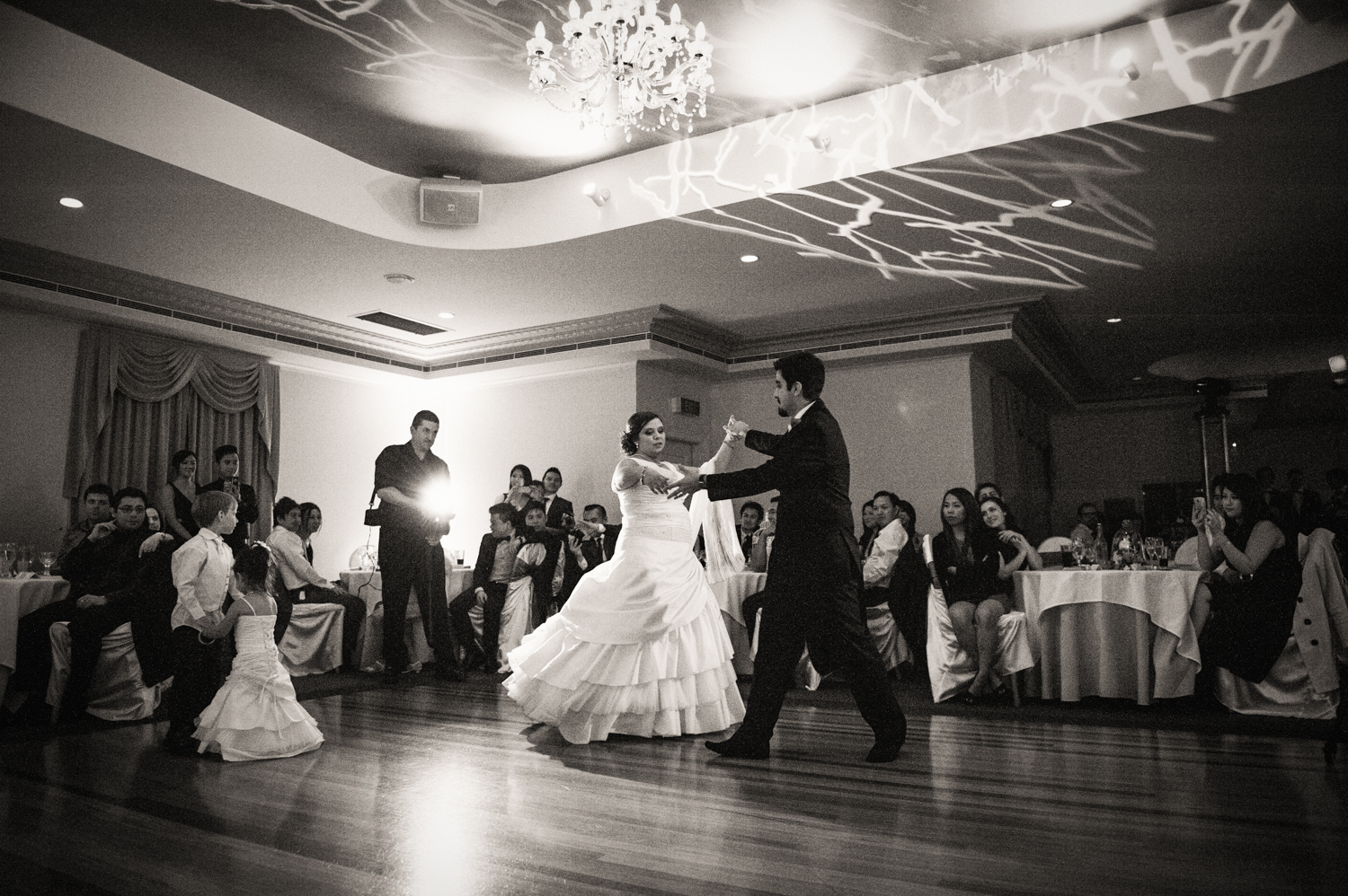 Bride and groom dancing in a beautiful ballroom, photographed by Mario Zmudzinski at Magnum Studio