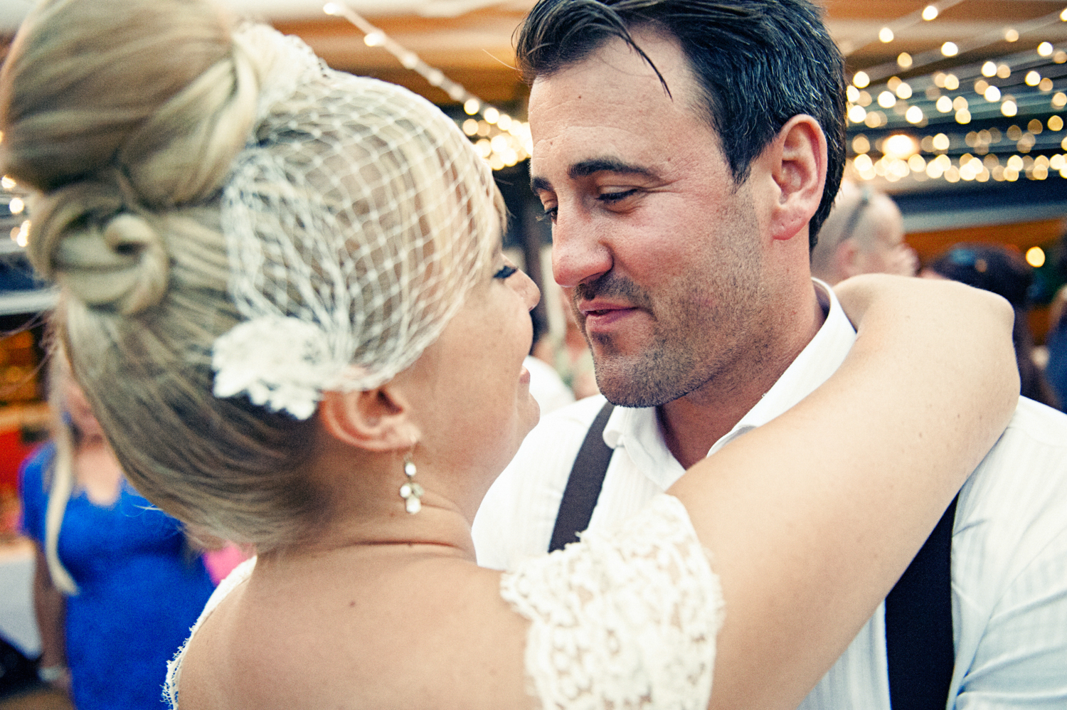 A loving couple gazing into each other's eyes on their wedding day.