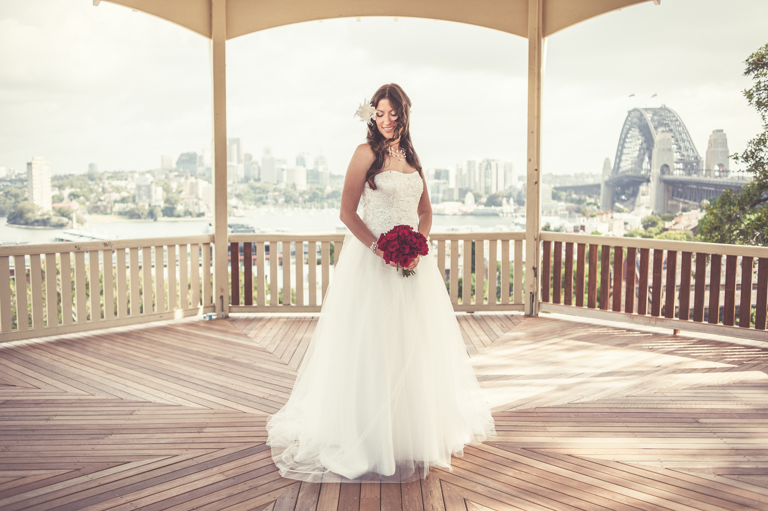 A stunning bride stands